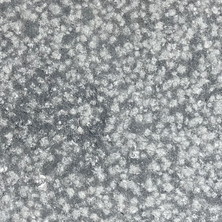 The surface finish shown is coarse bush hammered. The dominant color shown is gray. The color mix creates a cool feeling. Speckled and blotched color patterns.