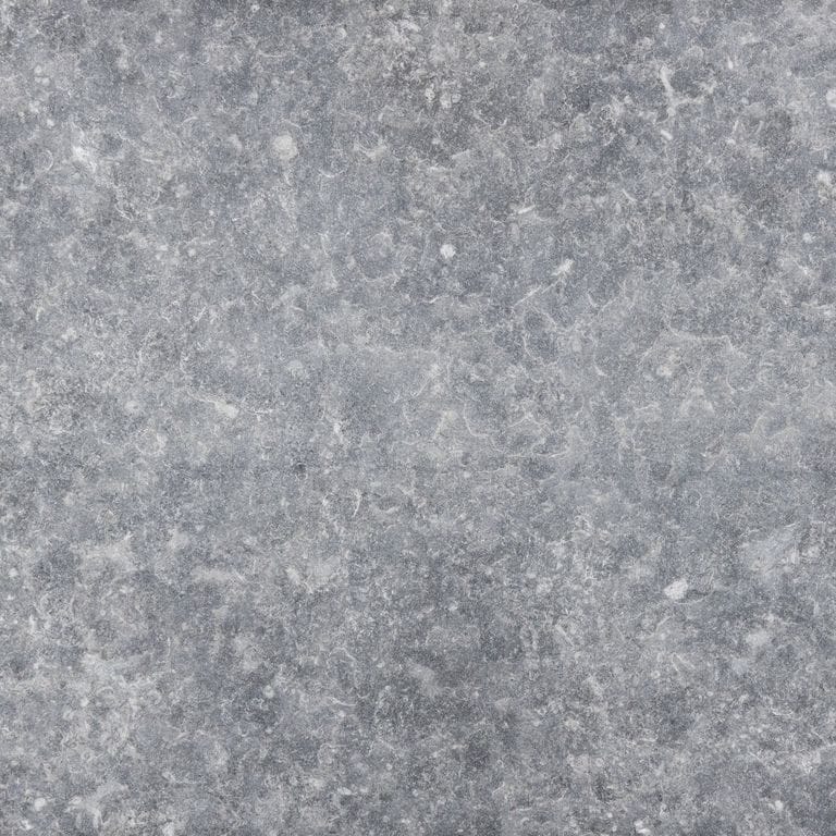 Best close-up image for Kilkenny Limestone. The surface finish shown is flamed. The dominant color shown is gray; with a white secondary. The color mix creates a cool feeling. Regular color pattern.