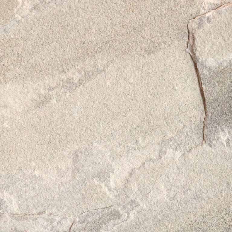 Best close-up image for Golden Fossil Sandstone. The surface finish shown is natural cleft. Dominant colors shown are beige and gray; with brown, orange/rust, white, tan and cream secondaries. Exhibits "movement" and the color mix creates a warm feeling. Regular, linear, streaked and cloudy color patterns.