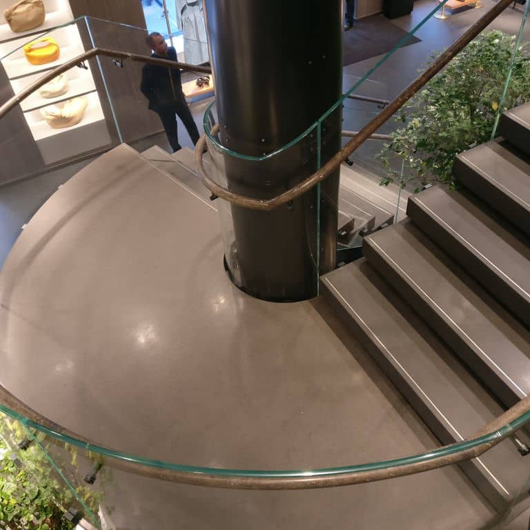 Application image for Basaltina Basalt. The image shows this material being used for interior floor and treads. The surface finish shown is polished. The dominant color shown is gray. The color mix creates a warm feeling. Solid color pattern.