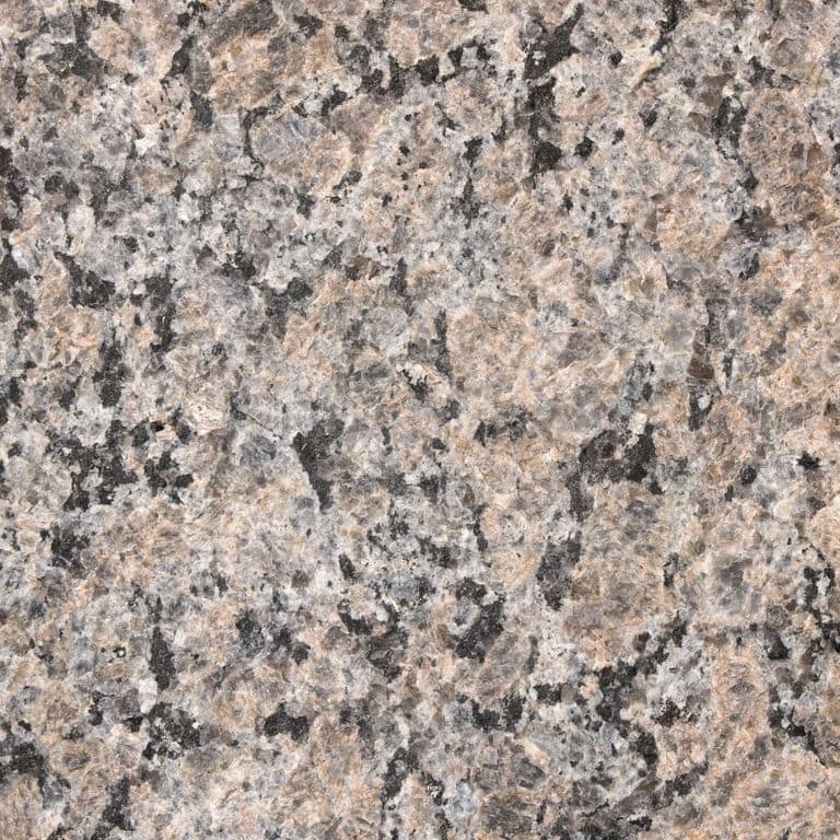 Color/Finish variation image for Granite - Autumn Brown. The surface finish shown is flamed. The dominant color shown is pink. Speckled and coarse speckled color patterns.