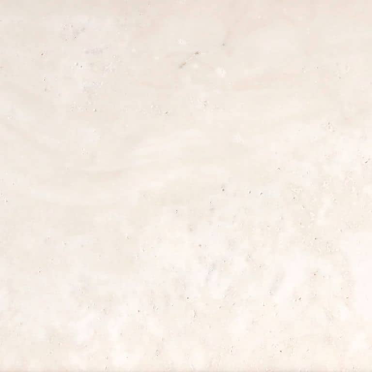 Feature image for Bianco Dei Travertine. The surface finish shown is honed. Dominant colors shown are beige, white and cream. The color mix creates a warm feeling. Solid and cloudy color patterns. Contains voids.