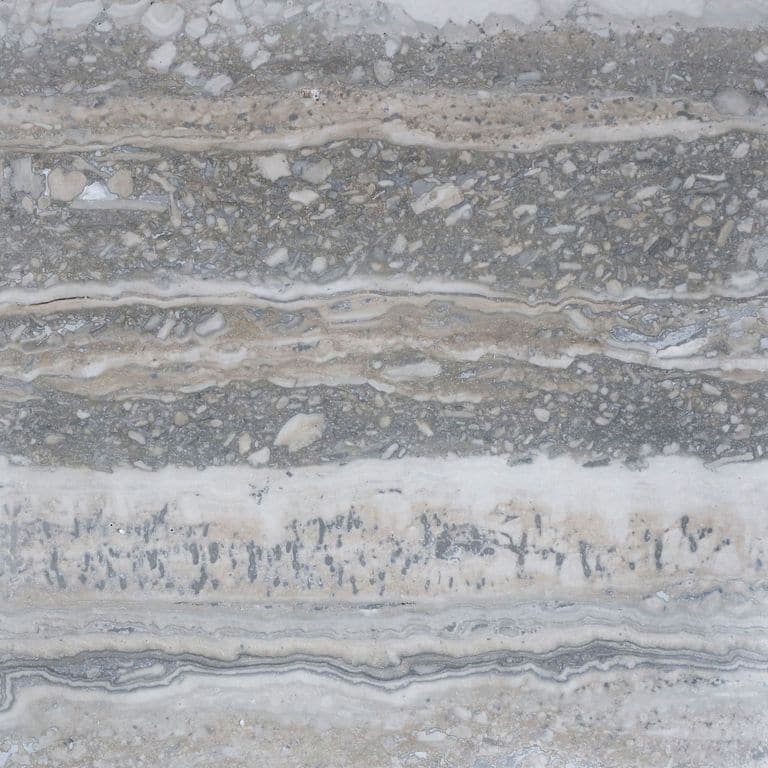The surface finish shown is honed. The dominant color shown is gray. The color mix creates a cool feeling. Blotched and streaked color patterns.