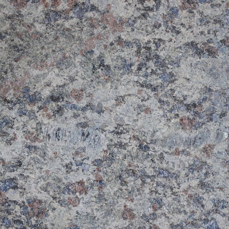 The surface finish shown is flamed. The dominant color shown is gray. The color mix creates a cool feeling. Speckled and coarse speckled color patterns.