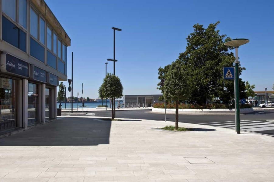 Application image for Veneto Beige Limestone - Pavers. The image shows this product being used in a public area application. The surface finish shown is flamed. The dominant color shown is gray. The color mix creates a warm feeling.