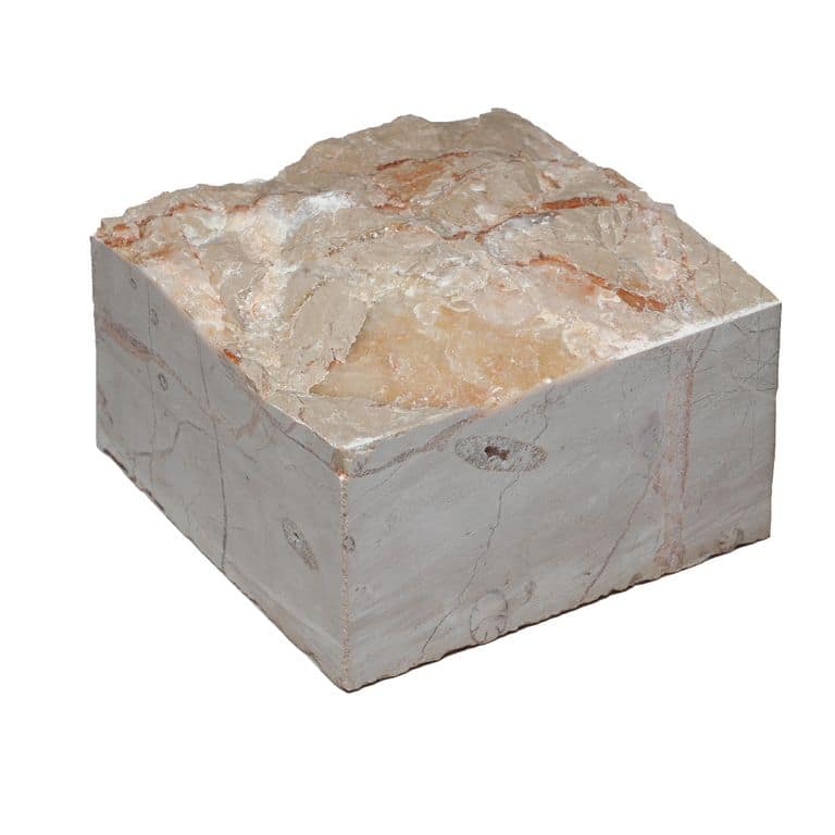 Oblique image for Portugese Alpine Limestone - Cobblestone - Splitface. The surface finish shown is split-face. Dominant colors shown are beige and pink. The color mix creates a warm feeling.
