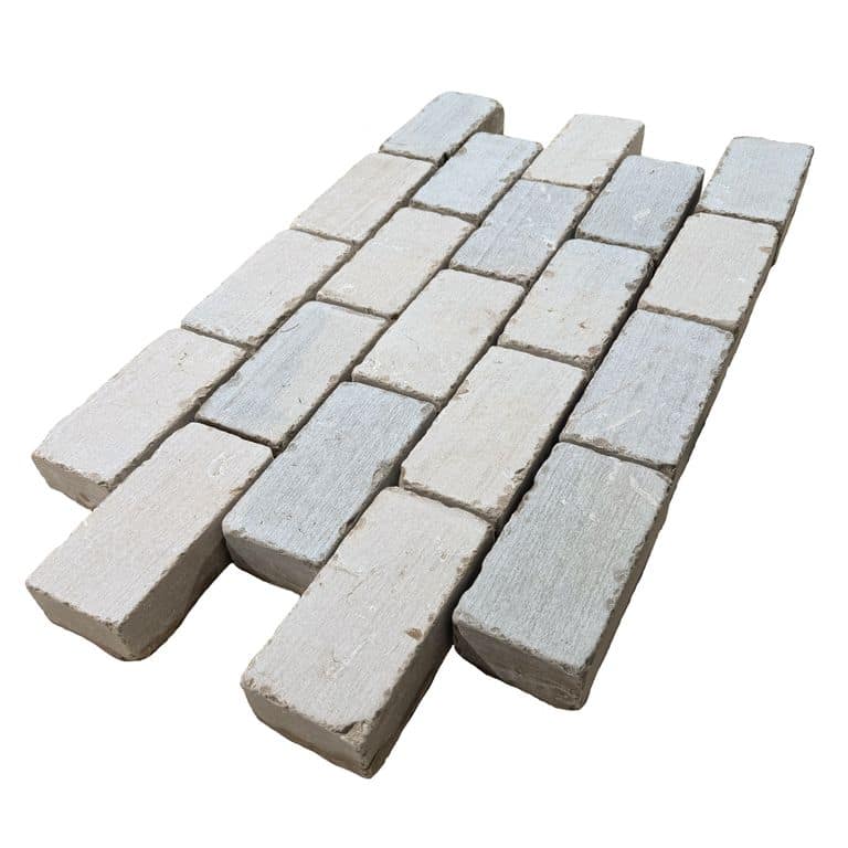 Feature image for Amaza Estrema Limestone Cobblestone - Rectangle - Tumbled. The surface finish shown is tumbled. Dominant colors shown are beige and gray.