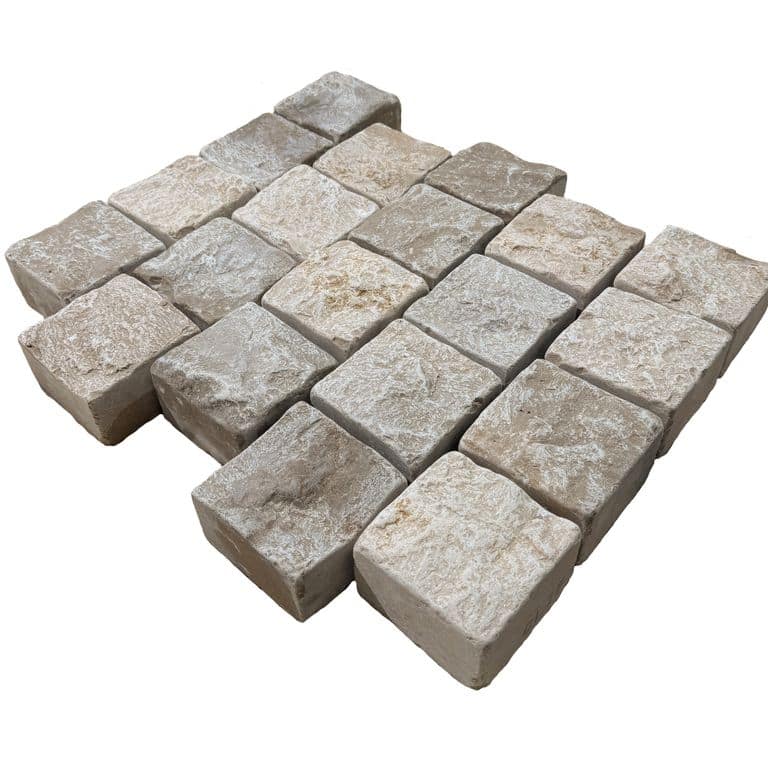 Feature image for Amaza Estrema Limestone Cobblestone - Square - Splitface &amp; Tumbled. The surface finish shown is . Dominant colors shown are beige and gray. The color mix creates a warm feeling.