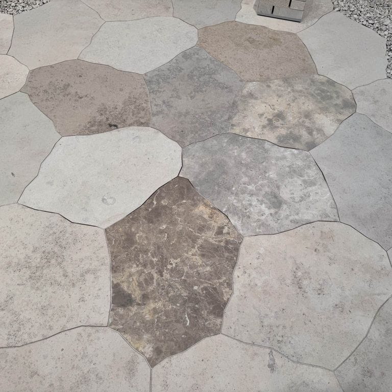 Feature image for Bavarian Dolomite Gray Limestone - Irregular Pavers - Waterjet Cut Edge. The image shows this product being used in a patio pavers application. The dominant color shown is gray.