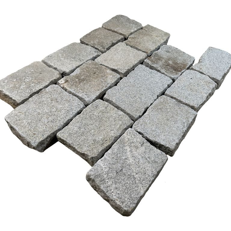 Oblique image for Reclaimed New England Granite - Bridge Squares. The surface finish shown is . The dominant color shown is gray. The color mix creates a cool feeling.