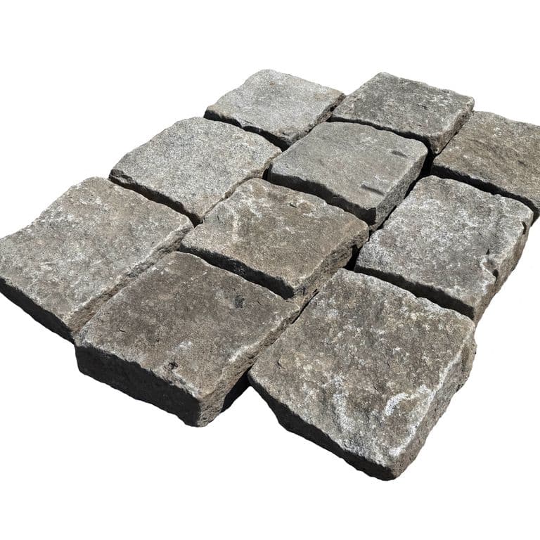 Oblique image for Reclaimed New England Granite - Bridge Squares. The surface finish shown is . The dominant color shown is gray. The color mix creates a cool feeling.
