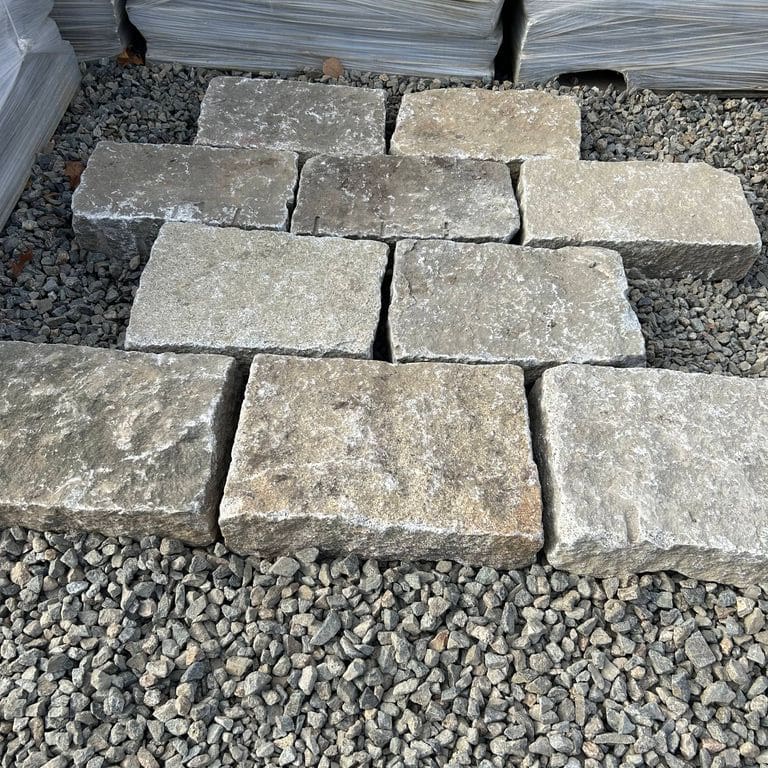 Feature image for Reclaimed New England Granite - Bridge Squares. The surface finish shown is . The dominant color shown is gray.
