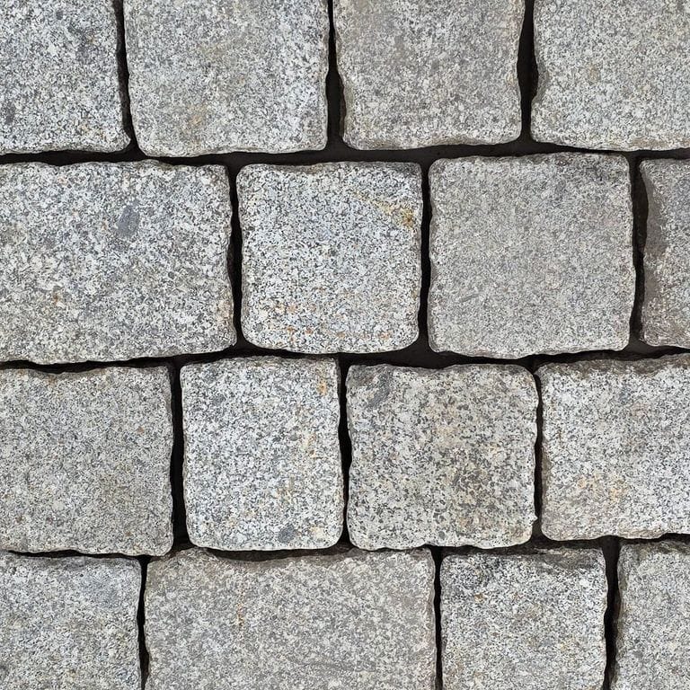 Color/Finish variation image for Reclaimed Berlin Granite Cobblestones - Worn Surface. The surface finish shown is . The dominant color shown is gray.