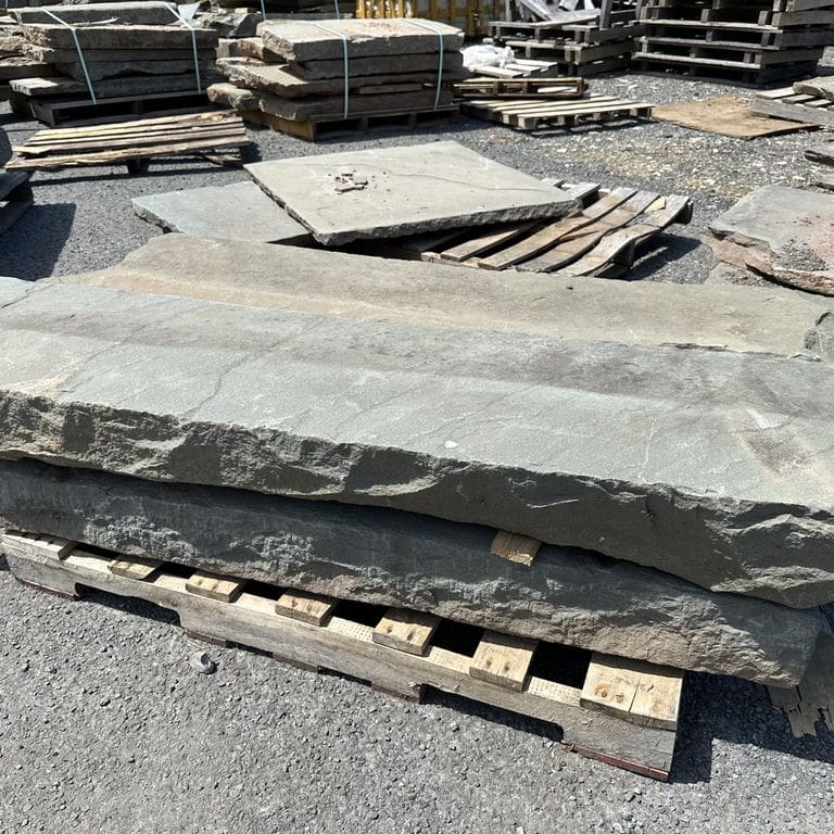 Application image for Reclaimed Bluestone Curbstone - Edging. The surface finish shown is . Dominant colors shown are blue, green and gray. The color mix creates a warm feeling.