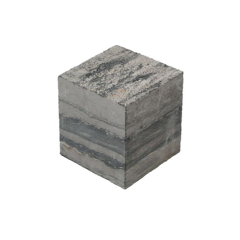 Color/Finish variation image for Black Schist Cobblestone - Square - Bush Hammered. The surface finish shown is bush hammered. The dominant color shown is gray. The color mix creates a cool feeling.