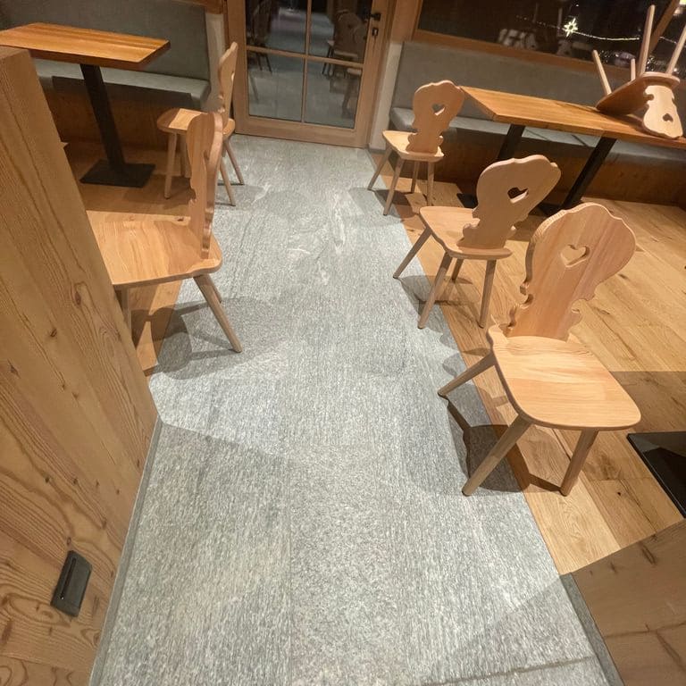 Application image for Pietra Italia Gray Gneiss - Interior Flooring. The image shows this product being used in an interior floor application. The surface finish shown is . The dominant color shown is gray. The color mix creates a cool feeling.