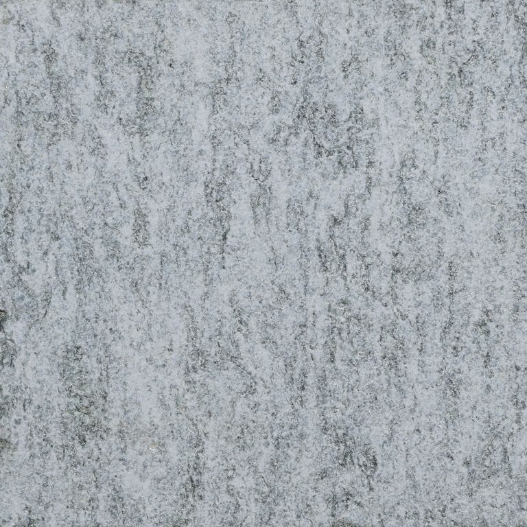 Color/Finish variation image for Pietra Italia Gray Gneiss - Pool Deck. The surface finish shown is sand blasted. Dominant colors shown are gray and white. The color mix creates a cool feeling.