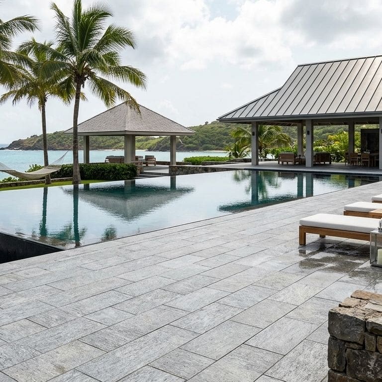 Application image for Pietra Italia Gray Gneiss - Pool Deck. The image shows this product being used for pool coping, patio pavers and pool deck pavers. The surface finish shown is sand blasted. The dominant color shown is gray.