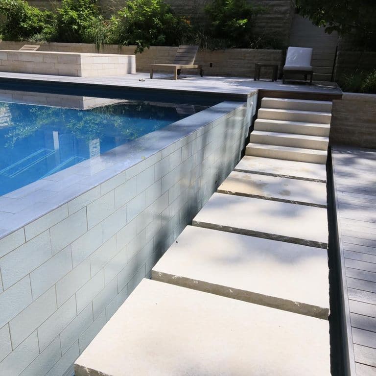 Application image for Mountain Hard Beige Limestone - Monolithic Steps. The image shows this product being used in a monolithic steps application. Dominant colors shown are beige and cream. The color mix creates a warm feeling.