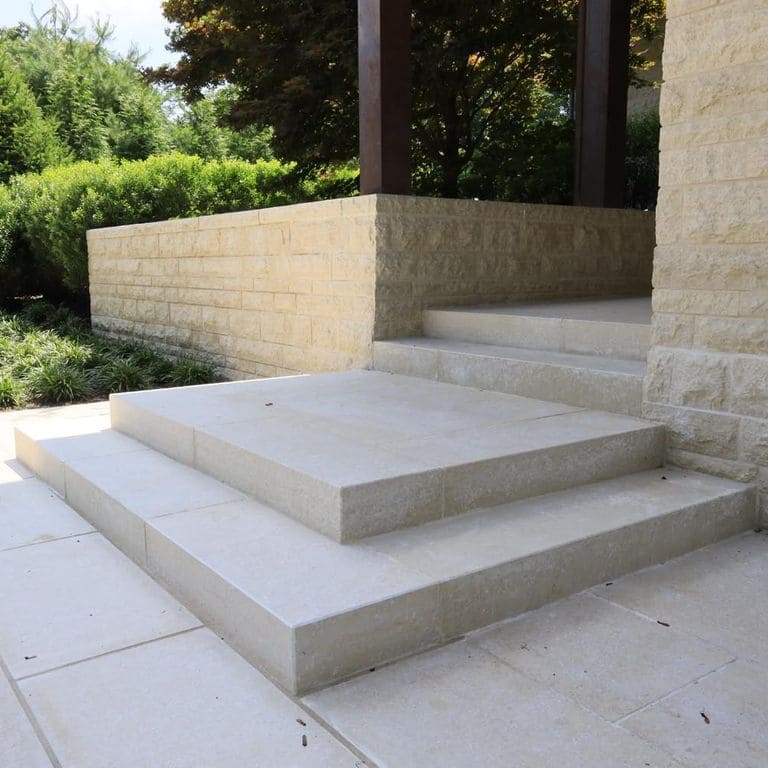 Application image for Mountain Hard Beige Limestone - Monolithic Steps. The image shows this product being used for landings and monolithic steps. Dominant colors shown are beige and cream. The color mix creates a warm feeling.