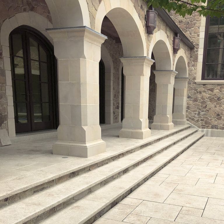 Application image for Mountain Hard Beige Limestone - Steps, Treads and Landings. The image shows this product being used in a treads application. Dominant colors shown are beige, tan and cream; with gray and white secondaries. The color mix creates a warm feeling. Regular and cloudy color patterns.