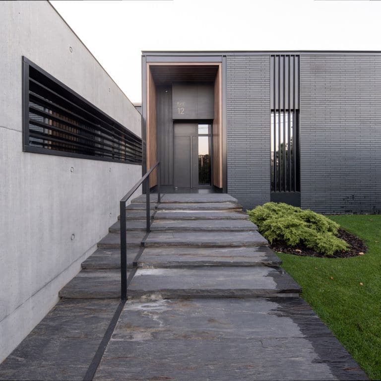 Application image for Black Schist - Steps, Treads &amp; Landings. The image shows this product being used for landings and treads. The surface finish shown is natural cleft. Dominant colors shown are black and gray. The color mix creates a warm feeling.