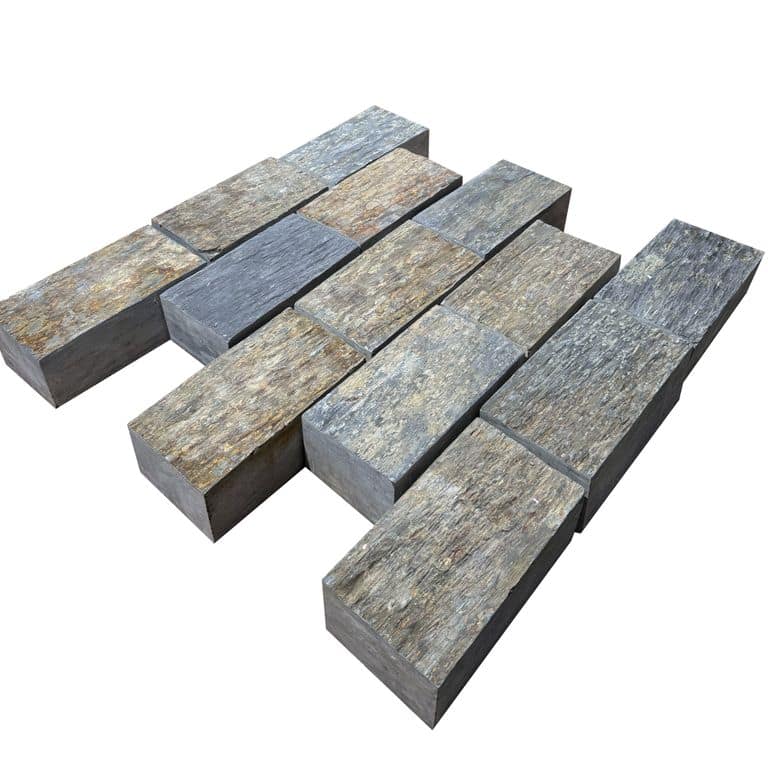 Feature image for Black Schist Cobblestone - Rectangle - Natural Cleft. The surface finish shown is natural cleft. Dominant colors shown are black, gray and orange/rust. The color mix creates a cool feeling.