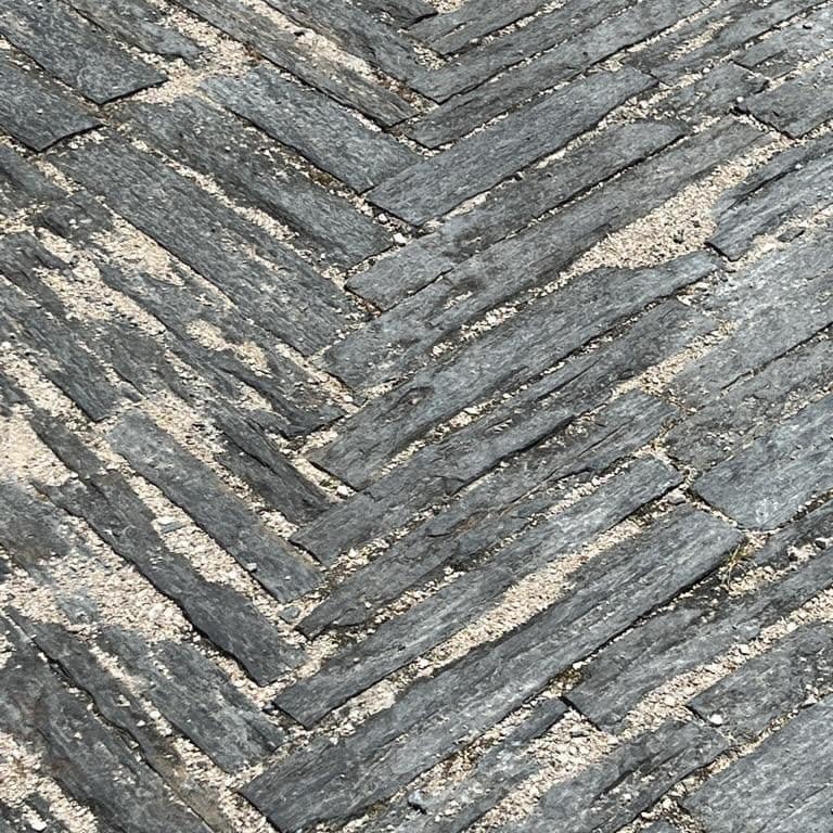 Application image for Black Schist Cobblestone - Rectangle - Natural Cleft. The surface finish shown is natural cleft. Dominant colors shown are black and gray. The color mix creates a cool feeling.