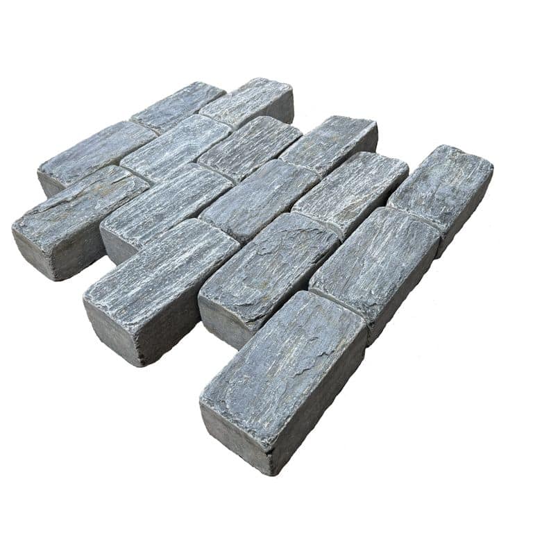 Application image for Black Schist Cobblestone - Rectangle - Natural Cleft &amp; Tumbled. The surface finish shown is natural cleft. Dominant colors shown are black, gray and orange/rust. The color mix creates a cool feeling.