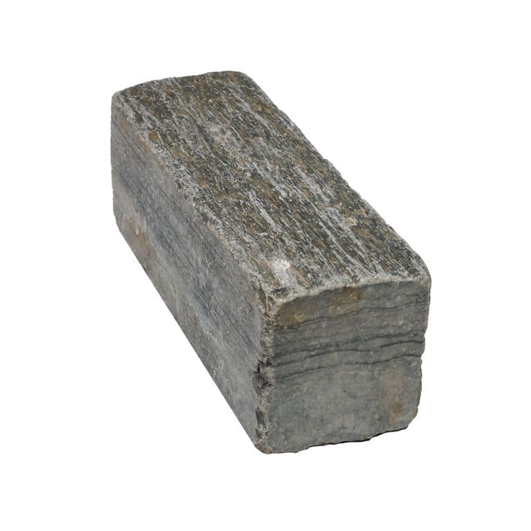 Color/Finish variation image for Black Schist Cobblestone - Rectangle - Natural Cleft &amp; Tumbled. The surface finish shown is natural cleft. The dominant color shown is gray. The color mix creates a warm feeling.