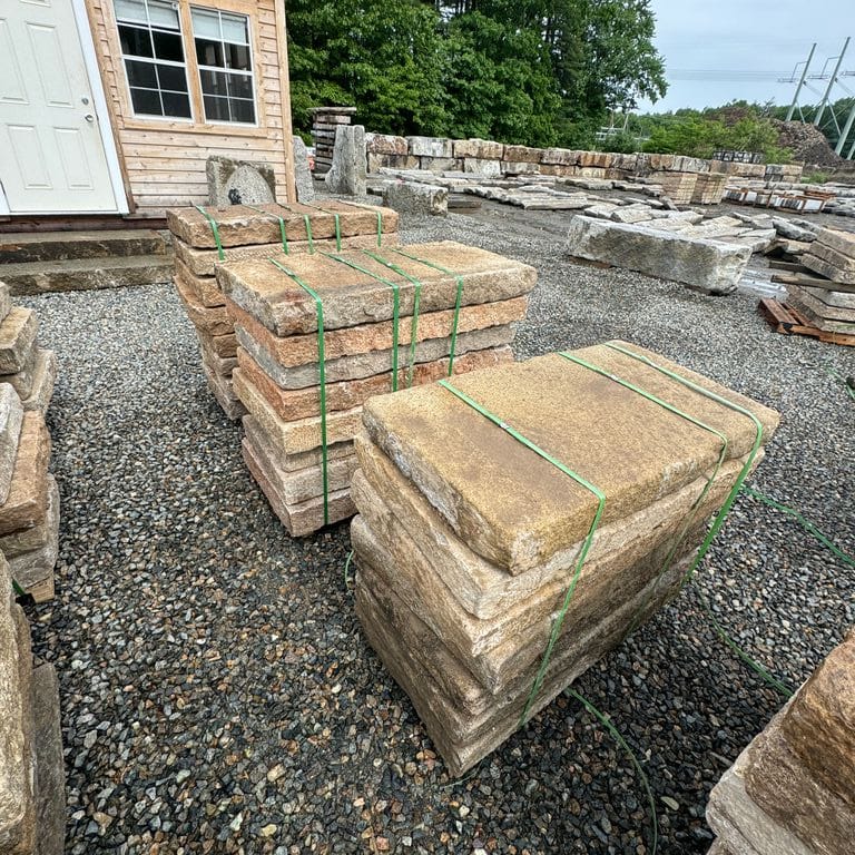Feature image for Reclaimed Rustic Golden Granite Planks 4x2' Planks. The surface finish shown is split-face. Dominant colors shown are gray and tan. The color mix creates a warm feeling.