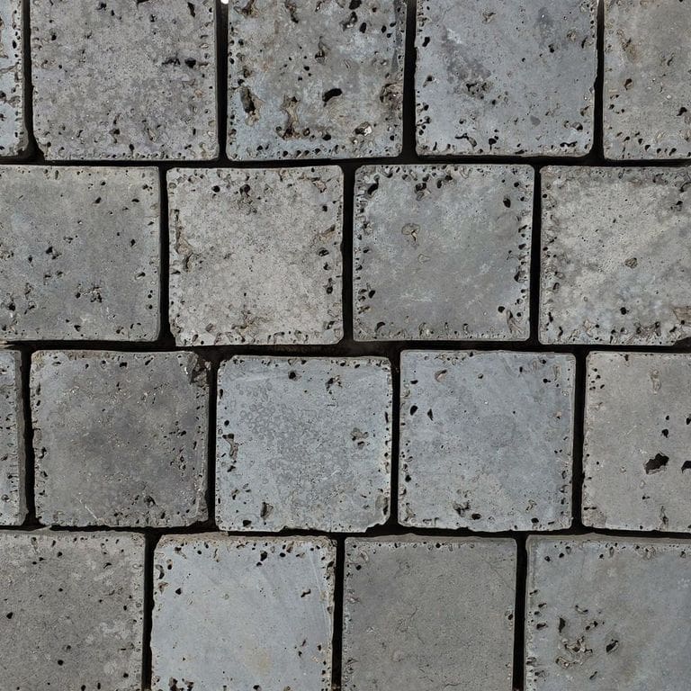 Best close-up image for Reclaimed German Slag Cobblestones - Sawn Top. The surface finish shown is sawn. The dominant color shown is gray. The color mix creates a cool feeling.