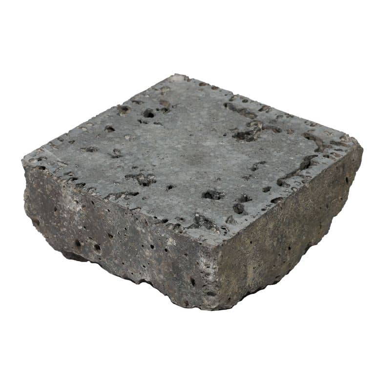 Oblique image for lava cobble flat side. The surface finish shown is sawn. The dominant color shown is gray. The color mix creates a cool feeling.