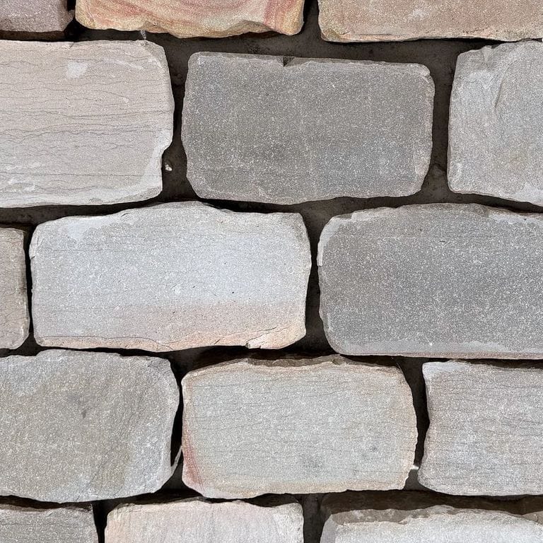 Color/Finish variation image for Reclaimed Saarland Limestone Cobblestones. The surface finish shown is . The dominant color shown is gray. The color mix creates a warm feeling.