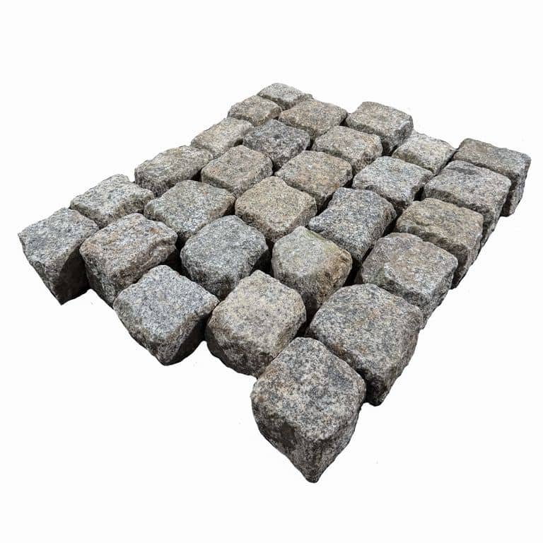 Feature image for Reclaimed Berlin Granite Cobblestones - Cubes. The surface finish shown is . Dominant colors shown are gray and white. The color mix creates a warm feeling.