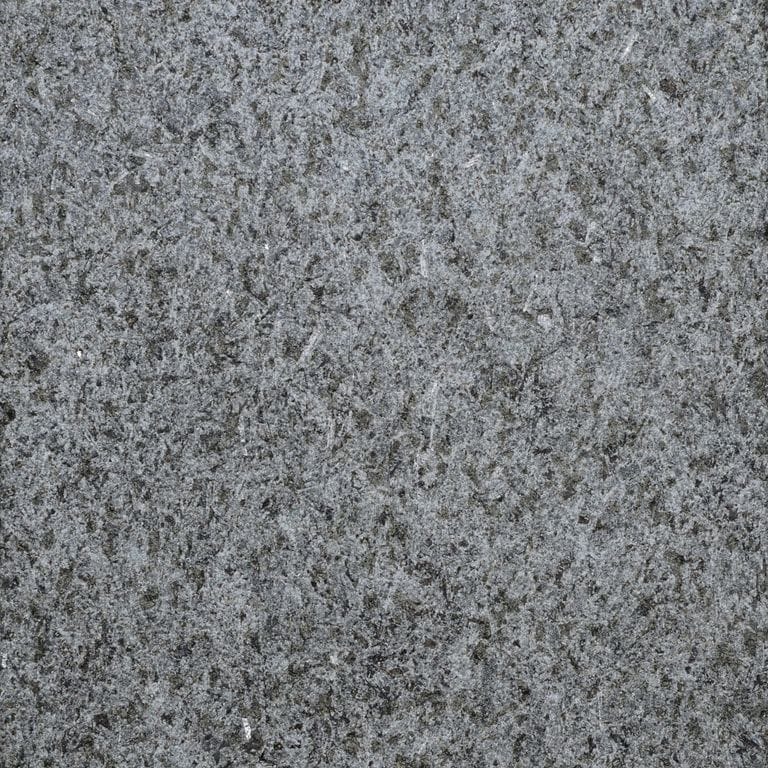 Color/Finish variation image for Superior Northern Granite - Pavers. The surface finish shown is sand blasted. Dominant colors shown are black and gray. The color mix creates a cool feeling.