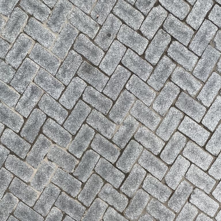 Application image for Superior Northern Granite - Cobblestones. The surface finish shown is tumbled. Dominant colors shown are black and gray. The color mix creates a cool feeling.