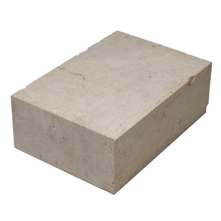 Oblique image for Bavarian Beige Limestone - Cobblestone Pavers. The surface finish shown is sawn. Dominant colors shown are beige and cream. The color mix creates a warm feeling.