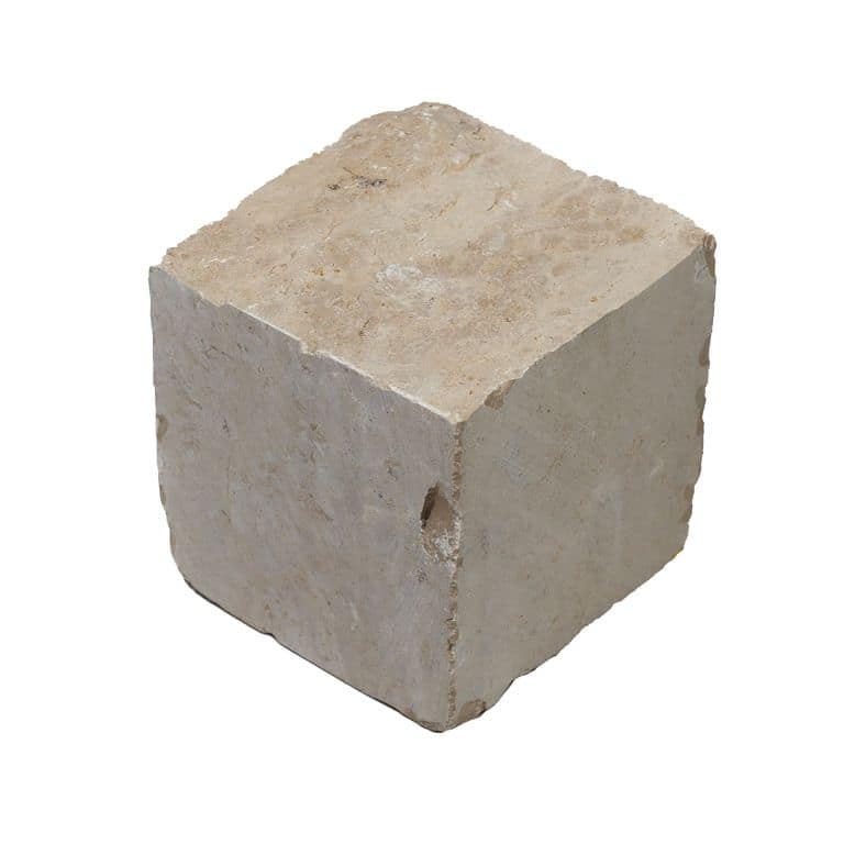 Oblique image for Bavarian Beige Limestone - Splitface Cobblestone. The surface finish shown is split-face. Dominant colors shown are beige and cream. The color mix creates a warm feeling.