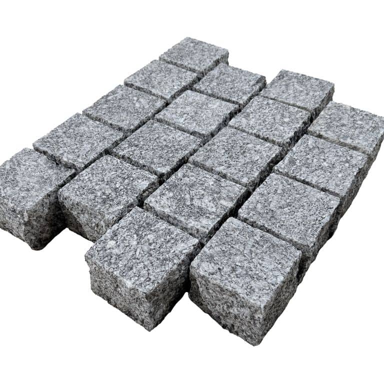 Feature image for Blue Ice Granite - Cobblestone. The surface finish shown is flamed. Dominant colors shown are blue and gray. The color mix creates a cool feeling. Blotched and coarse speckled color patterns.