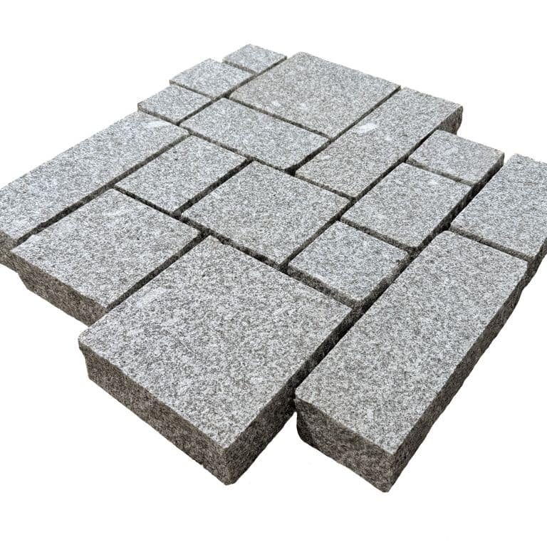 Feature image for Iberian Silver Granite - Cobblestones. The surface finish shown is flamed. Dominant colors shown are gray and white. The color mix creates a cool feeling.
