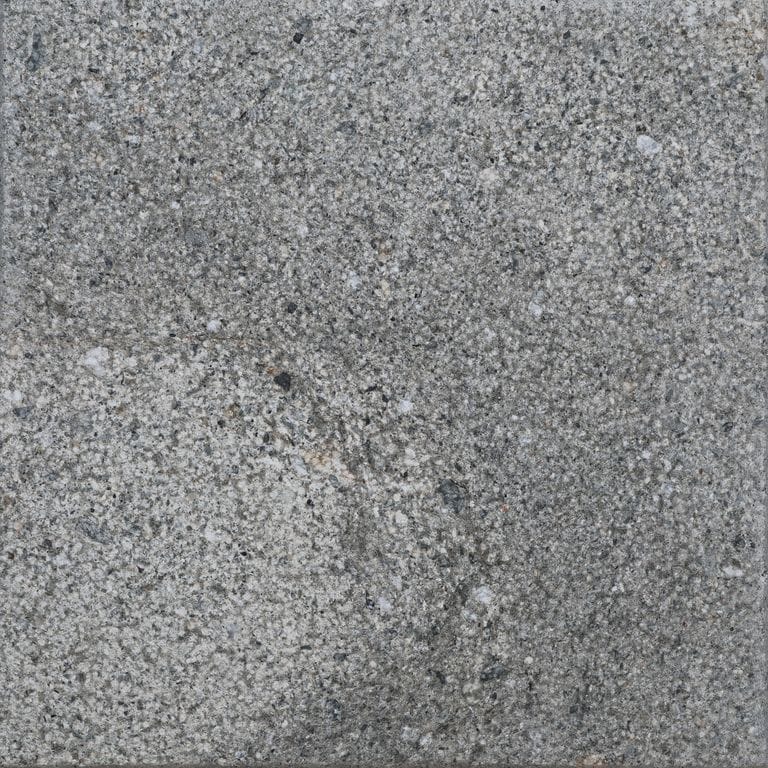 Color/Finish variation image for Titanium Gray Limestone - Pavers. The surface finish shown is bush hammered. The dominant color shown is gray. The color mix creates a cool feeling.