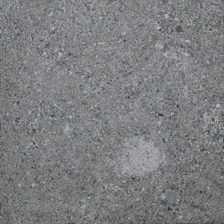 Color/Finish variation image for Titanium Gray Limestone - Pavers. The surface finish shown is sand blasted. The dominant color shown is gray. The color mix creates a cool feeling.