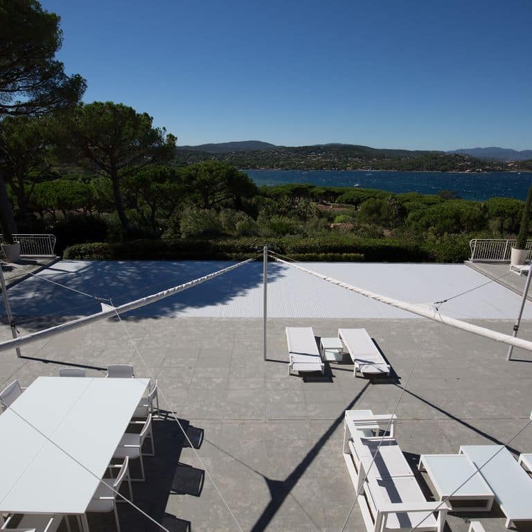 Application image for Titanium Gray Limestone - Pavers. The image shows this product being used for pool coping, patio pavers and pool deck pavers. The dominant color shown is gray. The color mix creates a cool feeling.