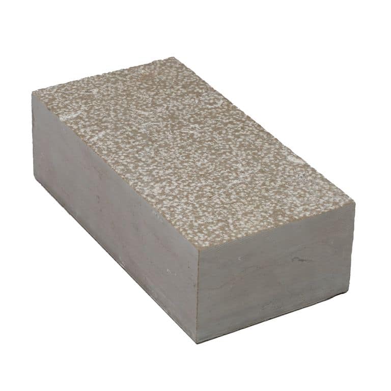 Oblique image for Amaza Estrema Limestone Cobblestone - Rectangle - Bush Hammered. The surface finish shown is bush hammered. Dominant colors shown are beige and gray. The color mix creates a warm feeling.