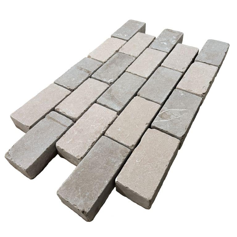 Feature image for Amaza Estrema Limestone Cobblestone - Rectangle - Flamed &amp; Tumbled. The surface finish shown is . Dominant colors shown are beige and gray.