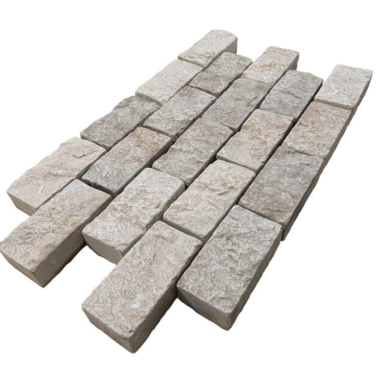 Feature image for Amaza Estrema Limestone Cobblestone - Rectangle - Splitface &amp; Tumbled. The surface finish shown is . Dominant colors shown are beige and gray. The color mix creates a warm feeling.