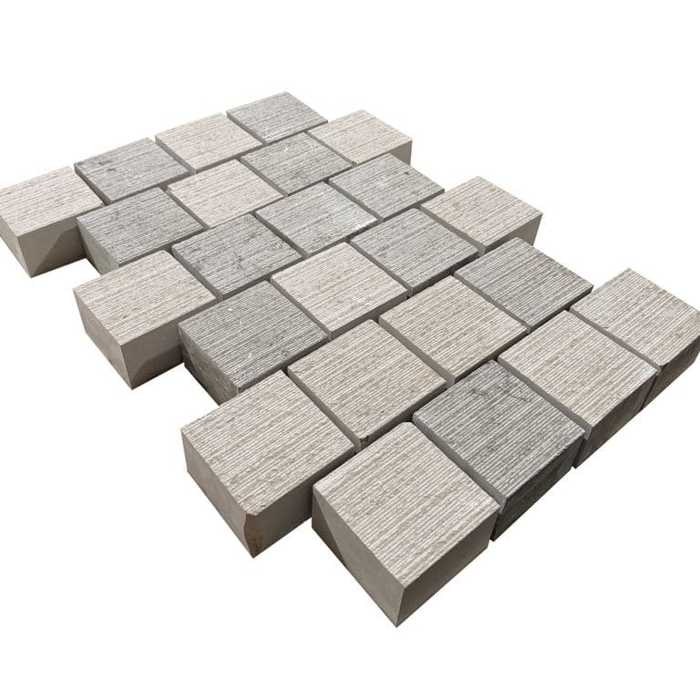 Feature image for Amaza Estrema Limestone Cobblestone - Square - Fine Scratched. The surface finish shown is . Dominant colors shown are beige and gray. The color mix creates a warm feeling.
