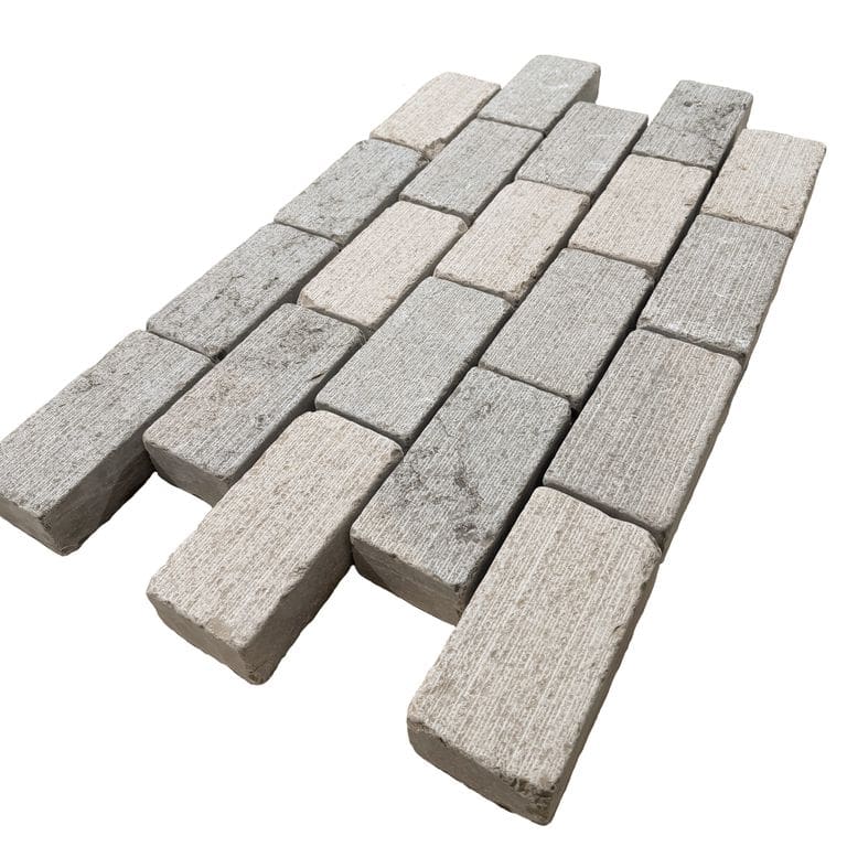 Feature image for Amaza Estrema Limestone Cobblestone - Rectangle - Fine Scratched &amp; Tumbled. The surface finish shown is . Dominant colors shown are beige and gray. The color mix creates a warm feeling.