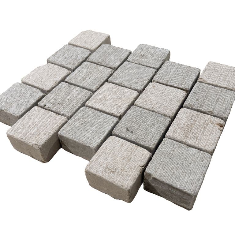 Feature image for Amaza Estrema Limestone Cobblestone - Square - Fine Scratched &amp; Tumbled. The surface finish shown is . Dominant colors shown are beige and gray.